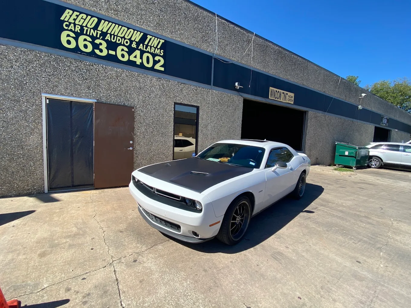 A finished Dodge Challenger outside the Regio Window Tint shop in Austin